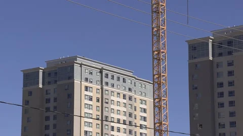 Construction cranes building new condominium apartment towers Stock Footage 150743079