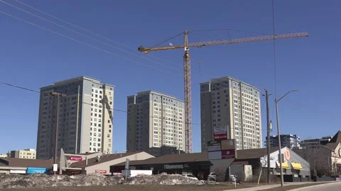 Construction cranes building new condominium apartment towers Видео 150743154
