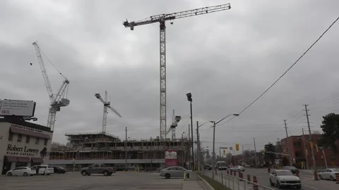 Construction cranes building new condominium development near Toronto Video stock 151187440