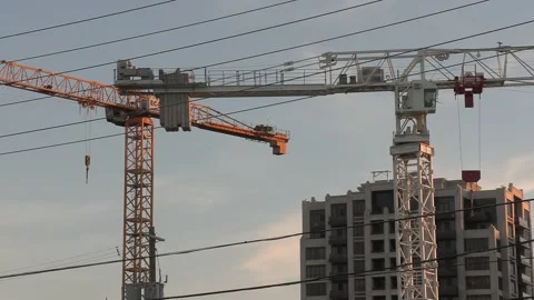 Construction cranes building new condominium development near Toronto Видео 156433141