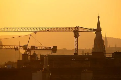 Construction cranes in the city Stock Photos
