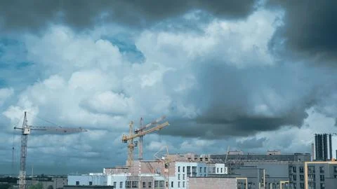 Construction cranes in the clouds Stock Photos