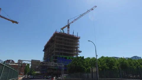 Construction Cranes Lifting Object on Tall Building in Portland  Stock Footage 92450507