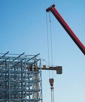 Construction cranes with a metal structure frame Stock Photos