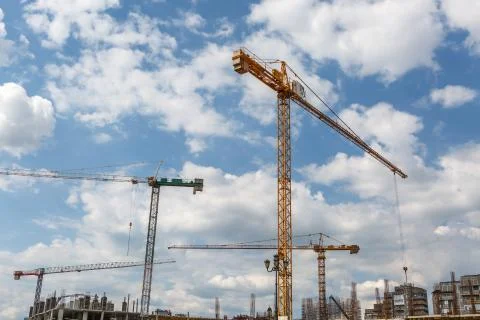 Construction cranes on a new building Stock Photos