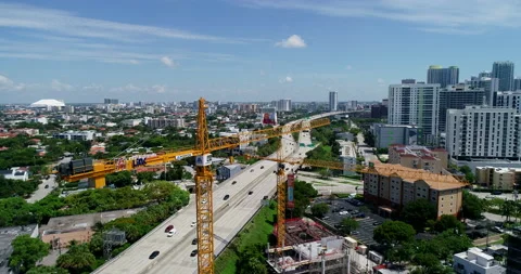 Construction cranes next to the highway in Miami Stock Footage 157256729