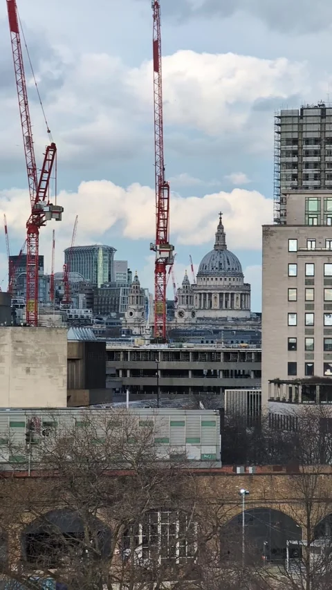 Construction cranes over London skyline with St. Paul's Cathedral dome Video stock 335636759