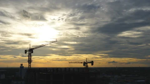 Construction cranes silhouettes over amazing sunset sky abstract. Stock-Footage 162375702