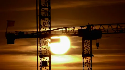Construction cranes silhouettes at sunset light. build develop growth background Video stock 40633326