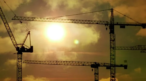 Construction cranes silhouettes at sunset light. build develop growth background Stock Footage 64541264