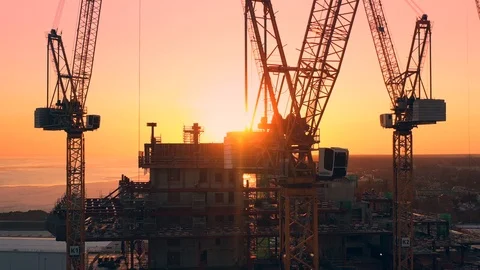Construction cranes on the sunset Stock Footage 106095024