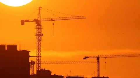 Construction cranes in sunset Stock Footage 120007146
