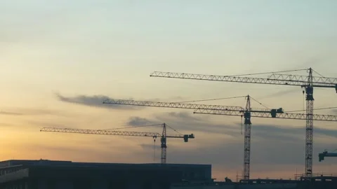 Construction Cranes at Sunset Stock Footage 309978814