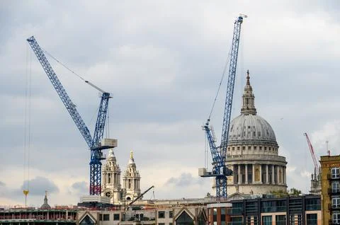 Construction cranes surround St Paul's Cathedral Stock Photos