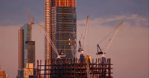 Construction cranes surrounding New York City skyscrapers being built. Stock Footage 67241605