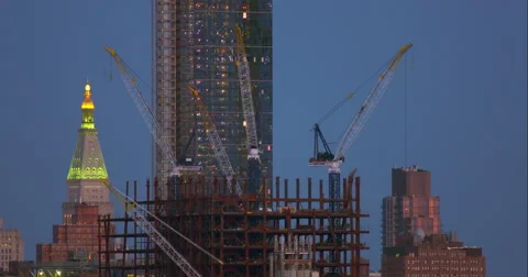 Construction cranes on top of building site on a clear night in New York City Stock Footage 67281498