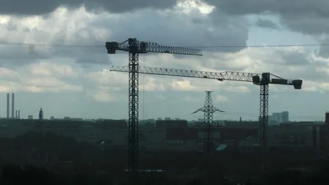 Construction cranes under the rain. Stockbeeldmateriaal 76038723