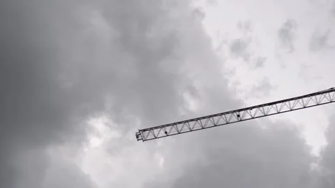 Construction cranes work on creation site against blue sky background. Stock Footage 241412427