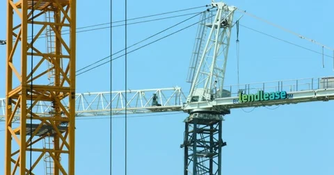 Construction cranes work at development site, 4K, RAW Stock Footage 66937490