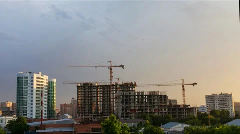 Construction cranes work from morning till evening Stock Footage 52339486