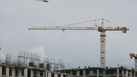 Construction cranes work tirelessly to shape a city skyline in progress Stock Footage 317603191