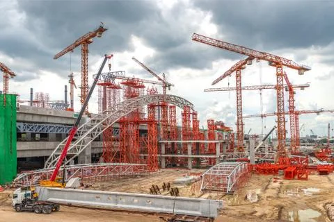 Construction Cranes Working on Expressway and Skytrain Site in Asia Stock Photos