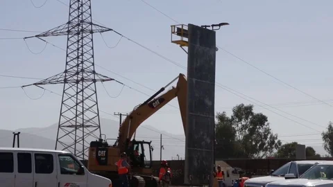 Construction crew assembling the prototype wall - 2017 Stock Footage 84693856