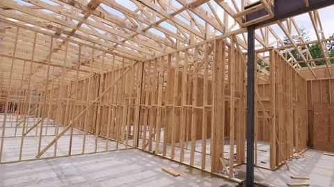 Construction crew builds wooden frame of large structure Video stock 337496733