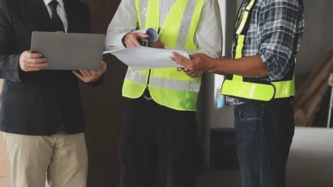 Construction crew collaboration on new project inspection footage Stock Footage 325351264