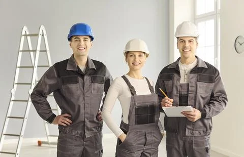 Construction crew team of builders in helmets for renovation and repair project Stock Photos