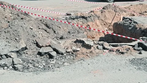 A construction crew is working at a site where a deep excavation is taking place Stock Footage 339016184