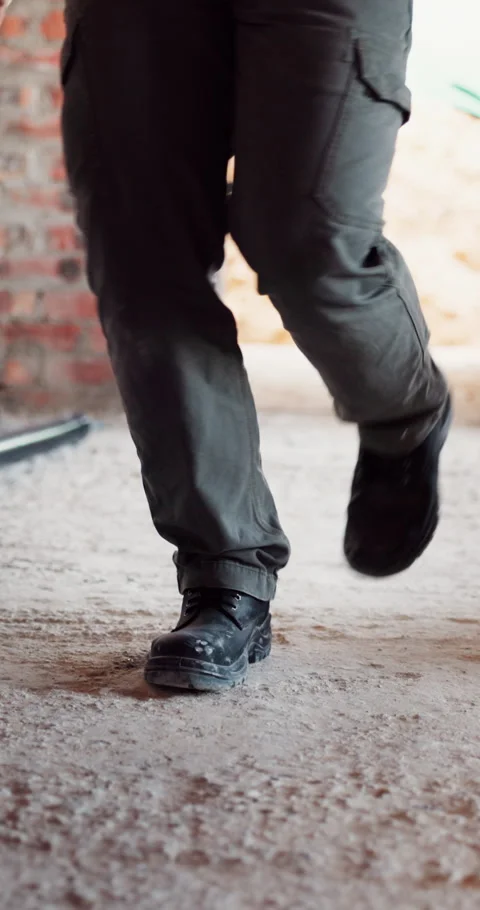 Construction, dance and legs on site with break, rhythm and playful groove with Stock Footage 336265143
