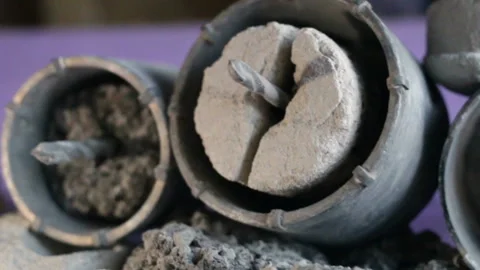 Construction debris and crowns for drilling holes in solid materials (for sub-ca Stock Footage 128829454