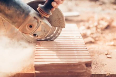 Construction details - close-up of angle grinder cutting through bricks Stock Photos