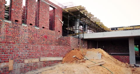 Construction, development and empty building outdoor, brick wall and concrete Stock Footage 336219731