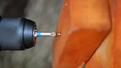 Construction disassembling. Screw is being untightened with cordless screwdriver Stock Footage 156686798