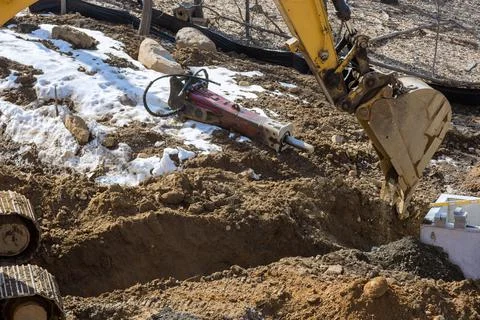 Construction of drain system with in ground with trench dug for a new link ro Stock Photos