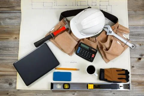 Construction drawing blue print with basic tools on top Stock Photos