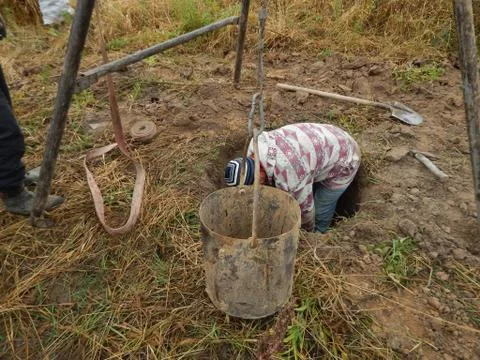Construction of a drinking well at the dacha Stock Photos