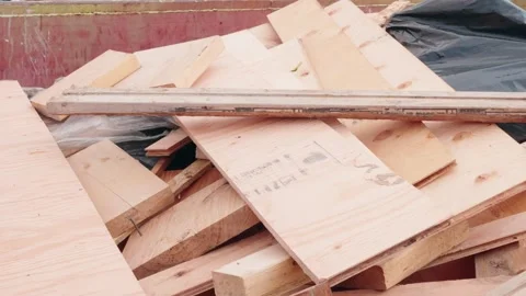 Construction Dumpster Filled with Scrap Lumber and Debris on Job Site Stock Footage 345237676