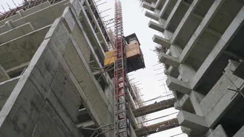 Construction elevator heading down in a construction site in Karachi, Pakistan. Stock Footage 307197485