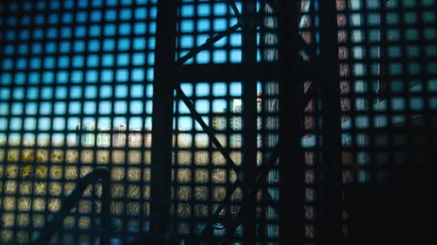 A construction elevator moves along the outside of an unfinished building Stock Footage 271331433