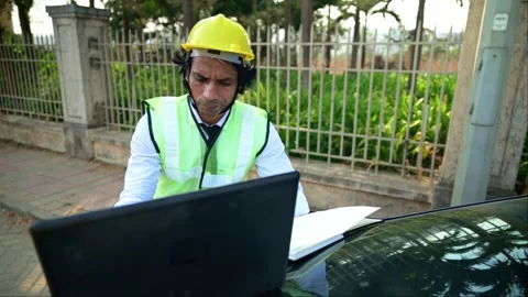Construction employee using laptop Stock Footage 277036469