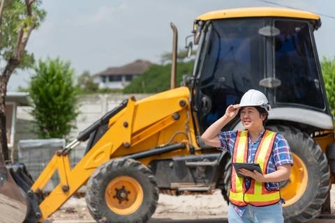 Construction Engineer with Backhoe Loader Stock Photos