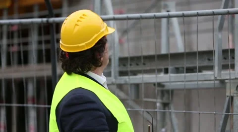 Construction engineer checking plans Stock Footage 59976049