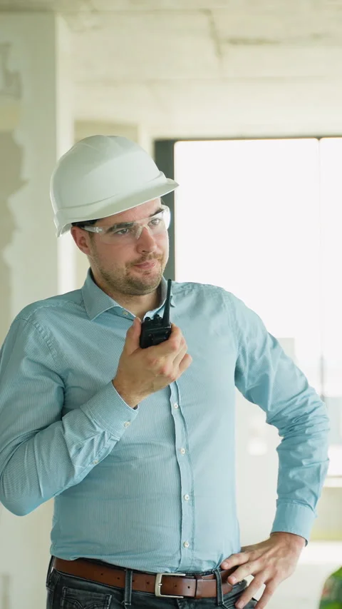 Construction Engineer Communicating via Radio on Job Site Stock Footage 285683885
