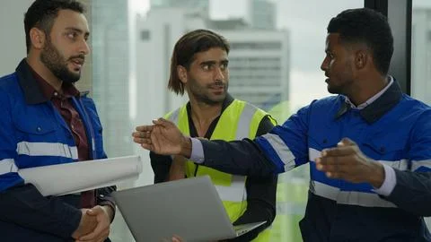 Construction engineer discussing and brainstorming with architects workers 스톡 사진
