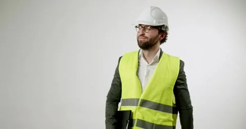 Construction Engineer in Hard Hat and Safety Vest Gives Thumbs Up on Background Stock Footage 344270946