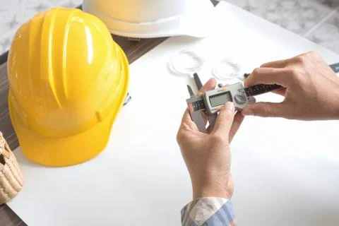 Construction engineer measuring with vernier caliper. Business and Technology Stock Photos