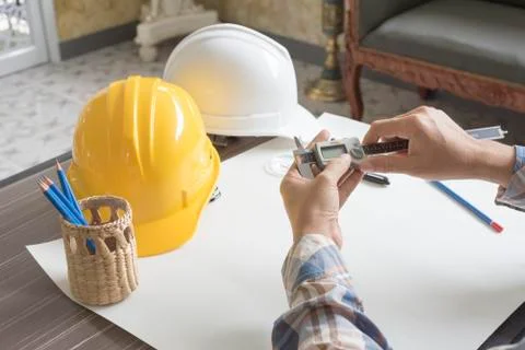 Construction engineer measuring with vernier caliper. Business and Technology 写真素材